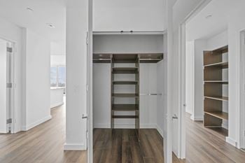 A small loft with a ladder in a white room